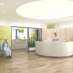 Empfangsbereich mit Holzfußboden und modernem Tresen im Reha-Zentrum