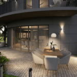 Moderne Terrasse an Rundbau mit Lounge- und Essbereich, stimmungsvoller Außenbeleuchtung und Blick in die Natur.