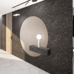Moderner Eingangsbereich mit schwarzer Natursteinwand, grafischem Wandmotiv, schwebendem Konsolentisch und Designleuchte.